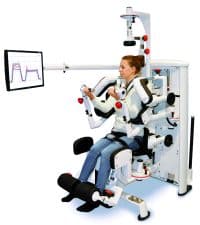 A person utilizes a diers biomedical product, a robotic rehabilitation device with arm and leg supports, while monitoring data on the screen. | FCE Scan